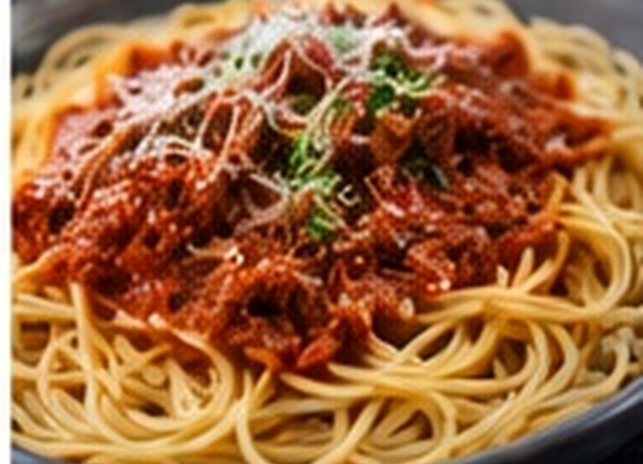 Spaghetti bolognese topped with grated cheese