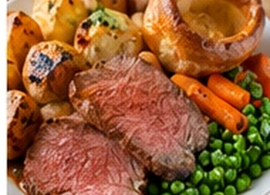 Roast beef with roast potatoes, Yorkshire pudding, carrots and peas